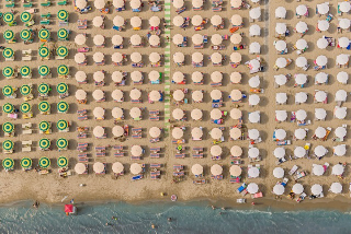 Illustration for article titled Aerial Shots of Beach Show Man Wringing Order From Nature